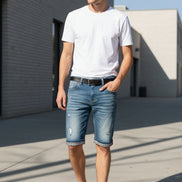 Blue denim shorts with plaid lining on a yellow background