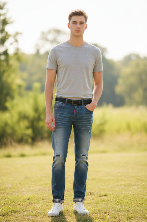 Blue denim shorts with plaid lining on a yellow background