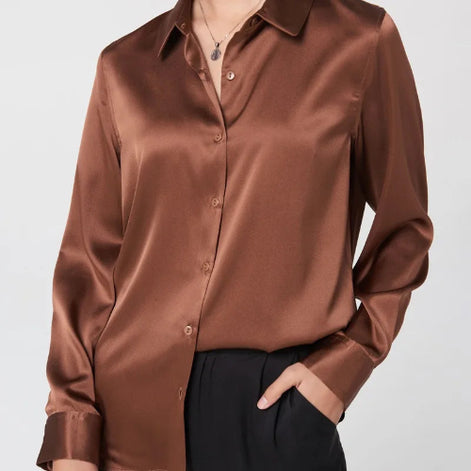Copper brown silk shirt with a collared button-front design, worn by a model.