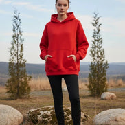 Red hoodie worn by a person on a white background