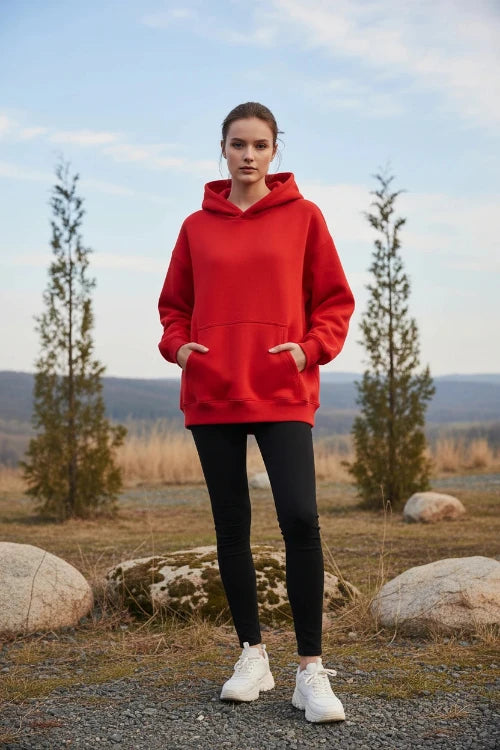 Red hoodie worn by a person on a white background