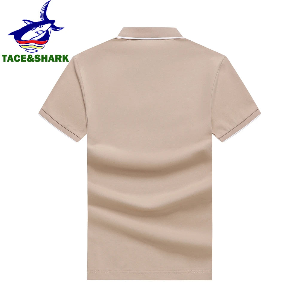 A beige short-sleeve polo shirt shown from the back on a white background, with a small TACE&SHARK logo in the top-left corner.