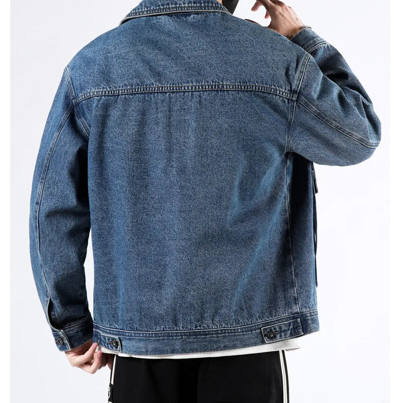 Blue denim jacket worn by a person on a white background