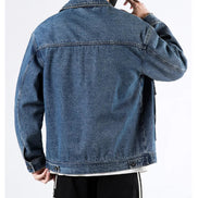 Blue denim jacket worn by a person on a white background