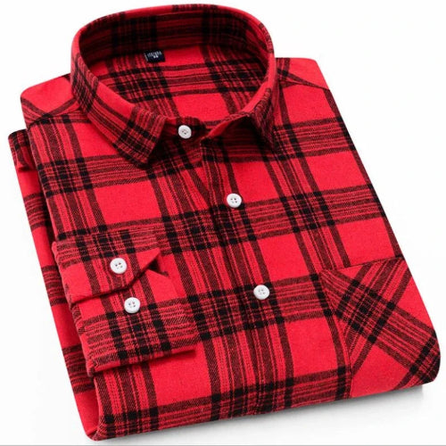 Folded red and black plaid shirt on a white background