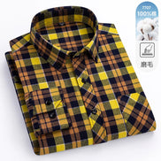 Folded plaid shirt with yellow and black pattern on a white background