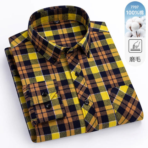 Folded plaid shirt with yellow and black pattern on a white background