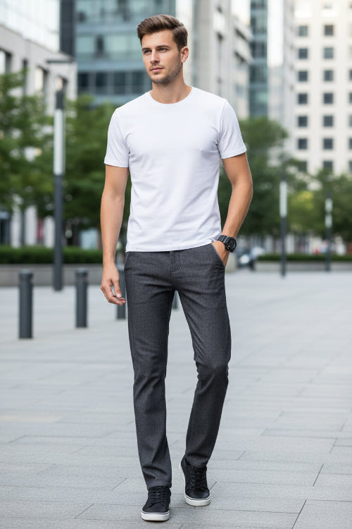 Gray pants with a close-up of the waistband label on a gray background