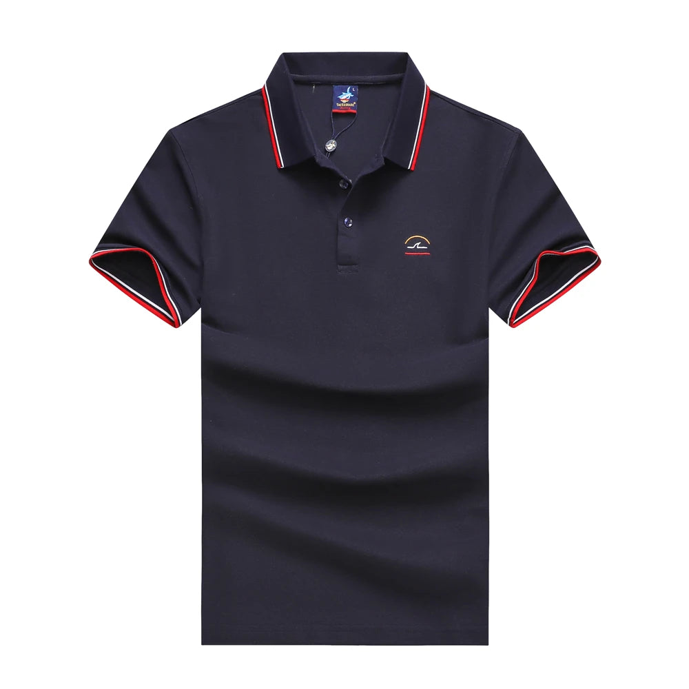 A dark navy blue short-sleeve polo shirt with red and white striped trim on the collar and sleeve cuffs, featuring a small embroidered rainbow logo on the left chest.