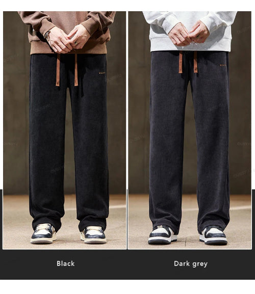 Two pairs of wide-leg pants, one black and one dark gray, worn by models against a neutral background.
