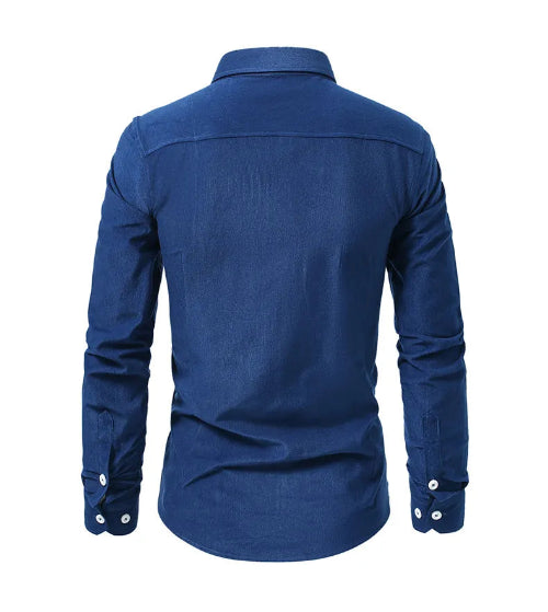 A men's long-sleeve button-up shirt in a rich medium blue, shown from the back view on a clean white background.