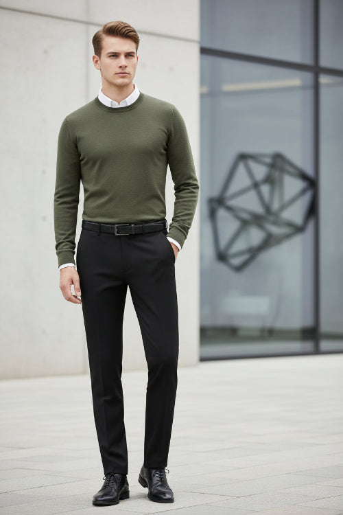 Black dress pants with a belt on a white background