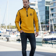 A men's long-sleeve quarter-zip pullover sweatshirt in bright yellow with black shoulder and sleeve stripes, featuring a mock neck collar, a chest zipper pocket, 