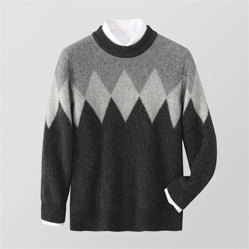 A men's long-sleeve knit sweater with a gray and black argyle pattern, layered over a white collared shirt, displayed on a wooden hanger against a solid gray background.