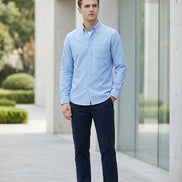 Light blue button-up shirt on a gray background