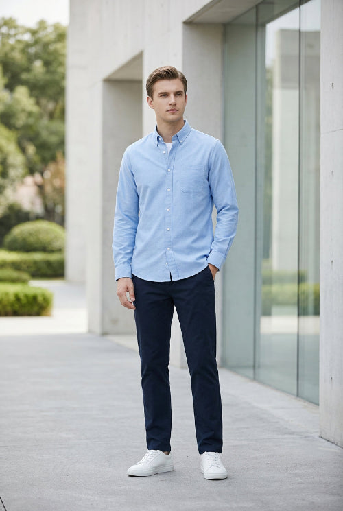 Light blue button-up shirt on a gray background