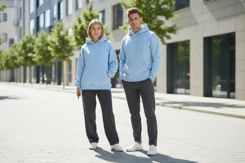 Light blue hoodie worn by a person on a white background