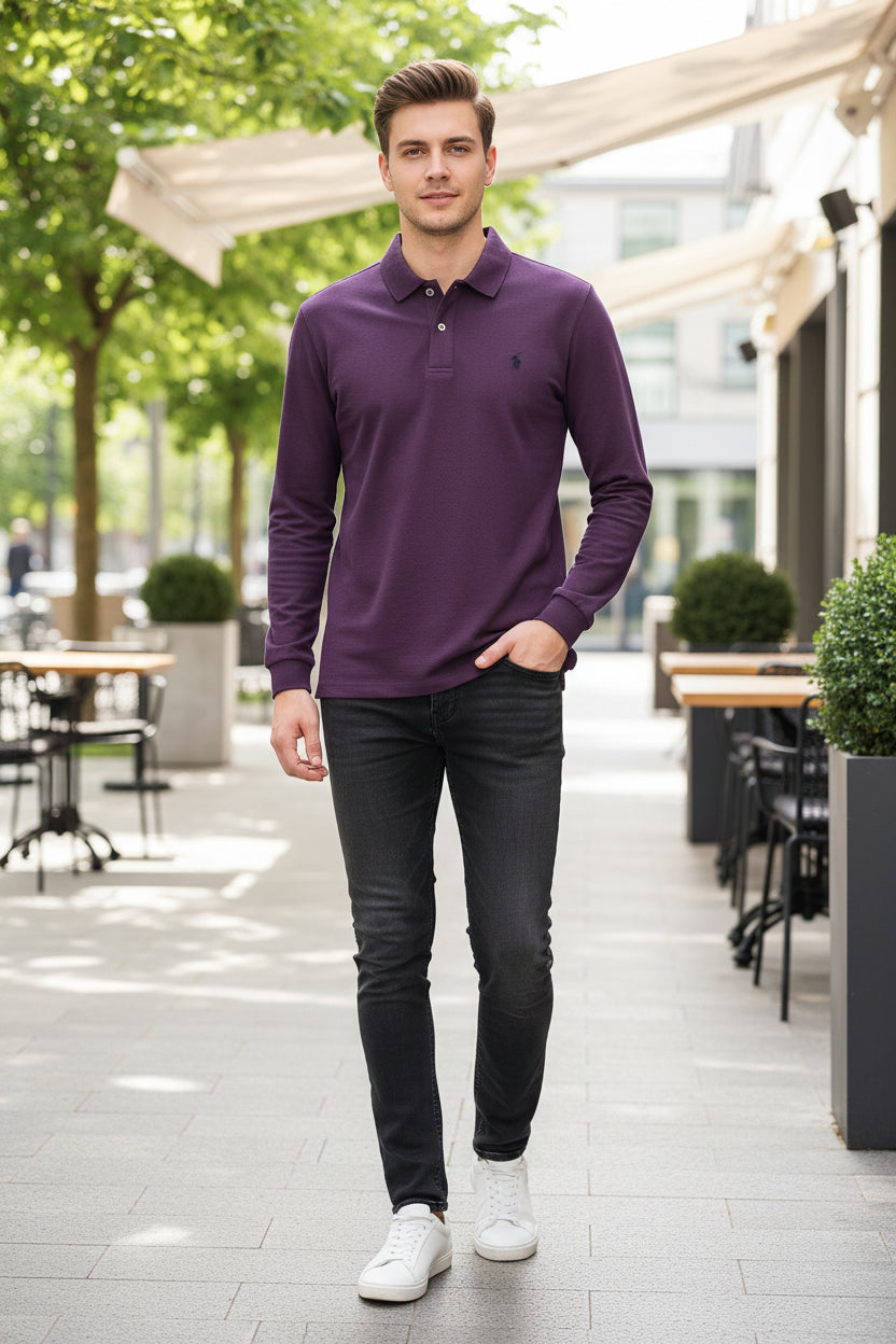 Purple polo shirt held by a hand with a visible brand logo, on a hanger against a blurred background.