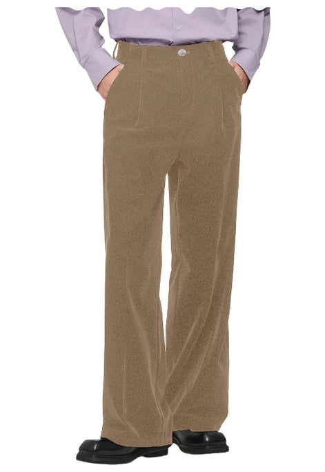 A person shown from the waist down wearing high-waisted, wide-leg brown corduroy trousers, a light purple ruffled blouse, and black shoes, 