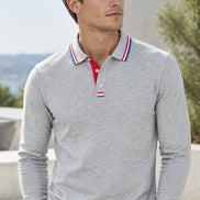 A light gray long-sleeve polo shirt with a red and blue striped collar and matching striped cuffs, 