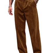 A person wearing brown corduroy trousers with a black belt, shown from the waist down against a plain white background.