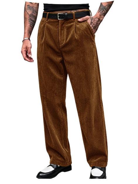 A person wearing brown corduroy trousers with a black belt, shown from the waist down against a plain white background.