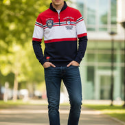Red, white, and black striped long-sleeve shirt with brand label on a white background