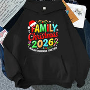 A black hoodie laid flat with a colorful Christmas-themed graphic reading 'FAMILY Christmas 2026' and 'MAKING MEMORIES TOGETHER.' The design includes multicolored lettering, candy cane accents, snowflakes, and a red Santa hat.