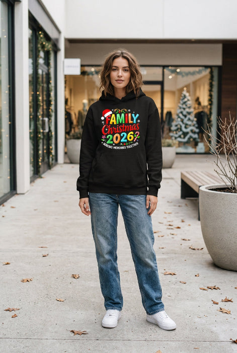 A black hoodie laid flat with a colorful Christmas-themed graphic reading 'FAMILY Christmas 2026' and 'MAKING MEMORIES TOGETHER,' 