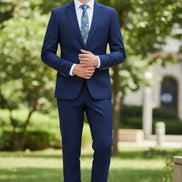 Navy blue suit with a white shirt, patterned tie, and brown shoes on a white background
