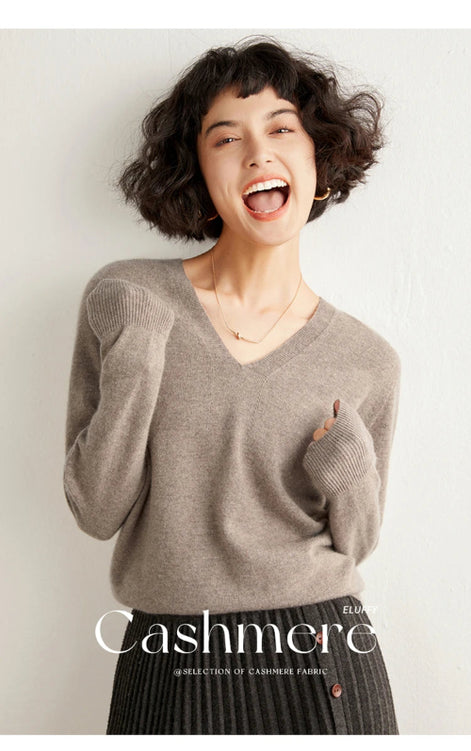 Woman wearing a gray cashmere sweater with 'Cashmere' text on a white background