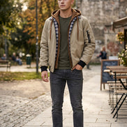 Beige jacket with plaid lining and brown hood on a white background