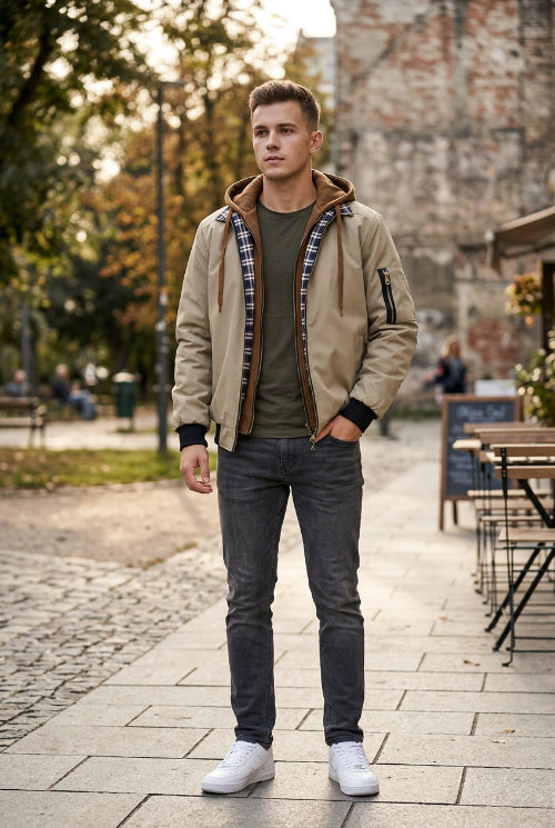 Beige jacket with plaid lining and brown hood on a white background