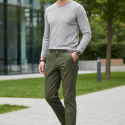 Green pants worn by a person on a gray background