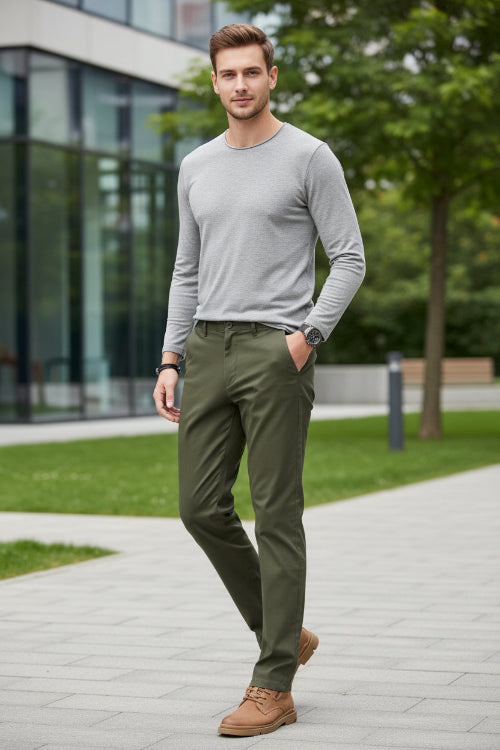 Green pants worn by a person on a gray background