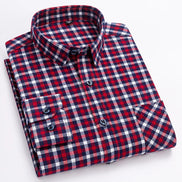 A folded long-sleeve plaid button-up shirt with a red, navy, and white checkered pattern, displayed on a clean white background.