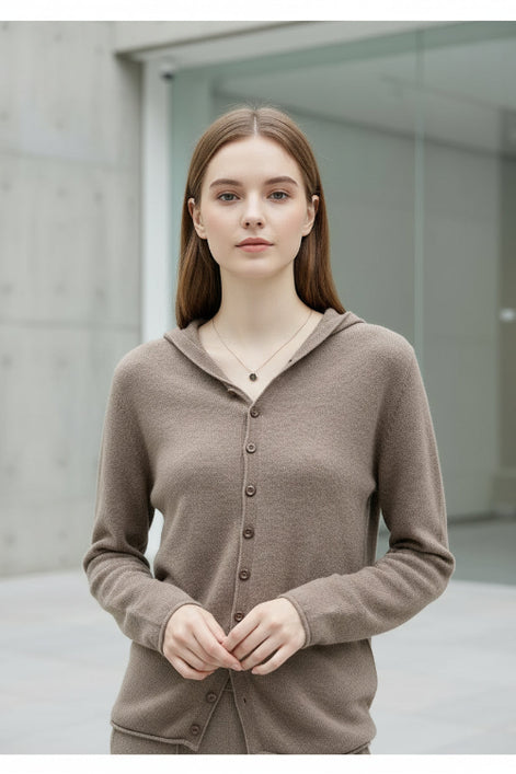 Beige cardigan worn by a person with a blurred background