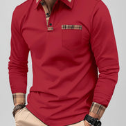 Man wearing a red long-sleeve shirt with plaid accents on a city street.