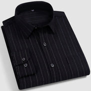 A folded long-sleeve button-up dress shirt in black with thin vertical gray pinstripes, shown on a white background with Chinese promotional text overlays and a product code M208-11.