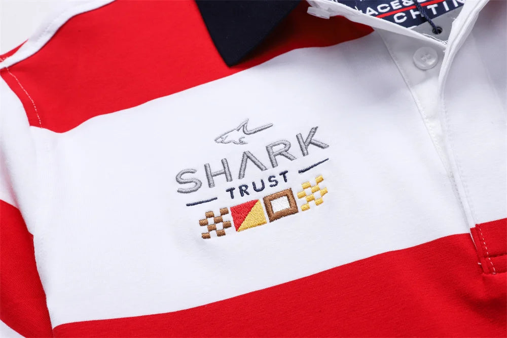 Red and white striped shirt with 'Shark Trust' logo on a white background