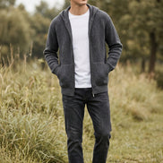Gray zip-up sweater on a mannequin against a gray background