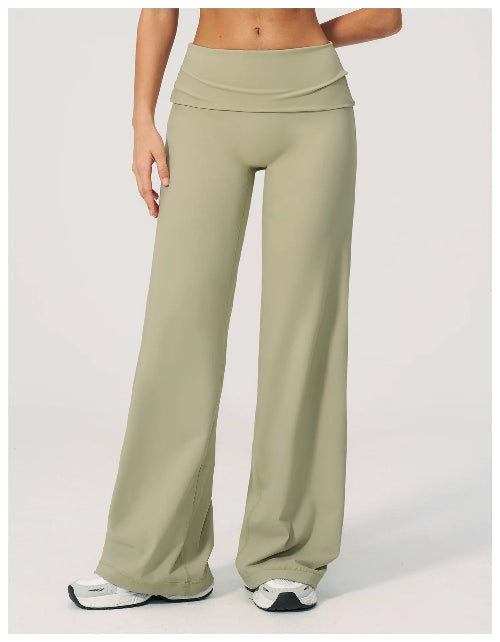 Green wide-leg pants worn by a person on a white background