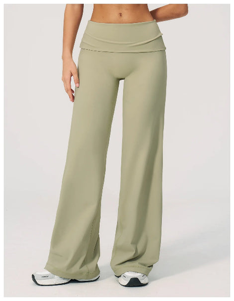 Green wide-leg pants worn by a person on a white background
