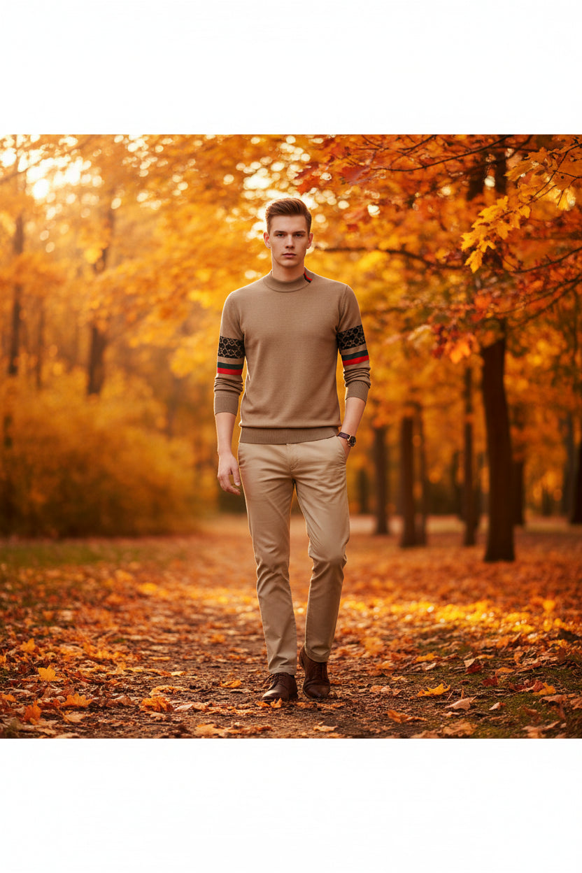 Beige sweater with patterned sleeves on a mannequin against a dark background