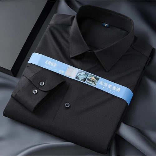 Folded black shirt with a blue band featuring text and graphics on a dark background