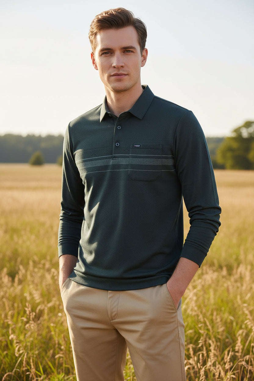 A man wearing a dark charcoal gray long-sleeve polo shirt with a textured knit pattern and horizontal stripe details across the chest. The image includes a graphic overlay in the top right corner showing a sheep and text that reads 'INCLUDES WOOL', 'SKIN FABRIC', and 'SOFT'.