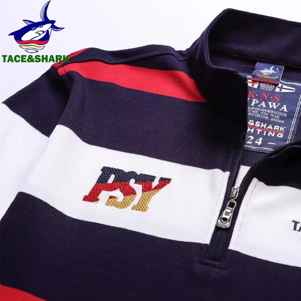 A close-up of a quarter-zip pullover sweatshirt with horizontal color-blocked stripes in navy, white, and red. The front features a large embroidered 'BSY' logo in red, navy, and gold, and a visible 'Pawa' brand tag inside the collar.