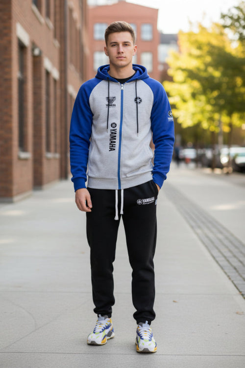 Gray and blue hoodie with Yamaha branding, paired with black pants and colorful sneakers on a white background.