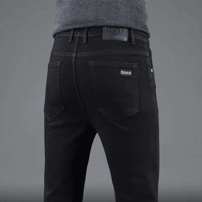 Black jeans with Levi's branding on a gray background