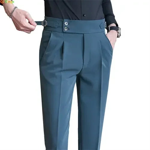 Blue pants with a belt being adjusted on a white background